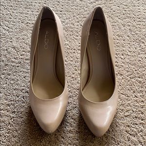Tan Aldo high heels.